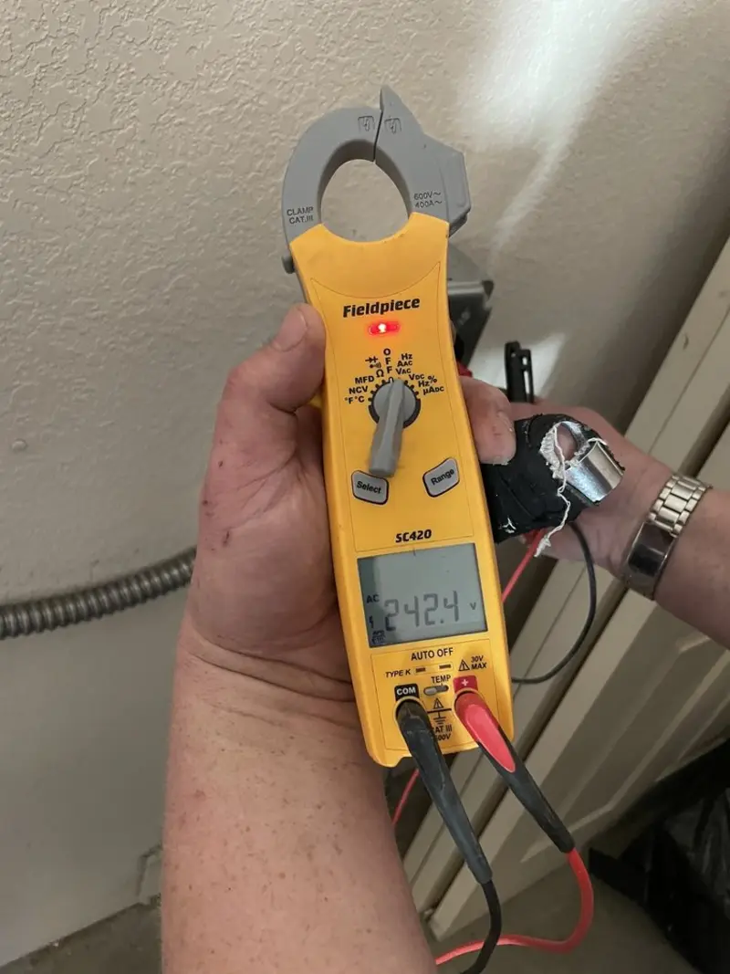 Voltage testing with clamp meter during Electrical Installation Services in Signal Hill
